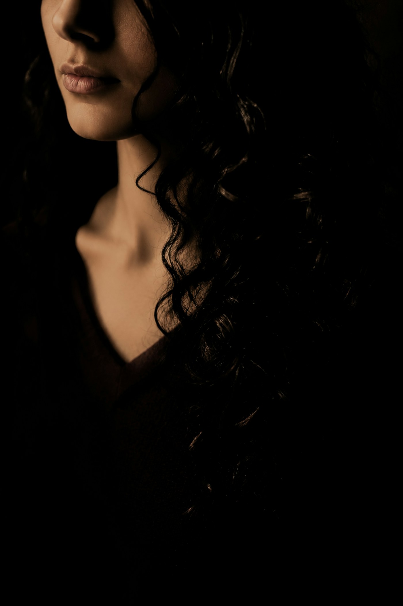 Dark curls in soft light